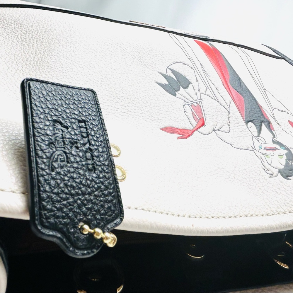 Disney X Coach Dempsey Carryall With Cruella Motif
Brand new with tags - Picture 8 of 15